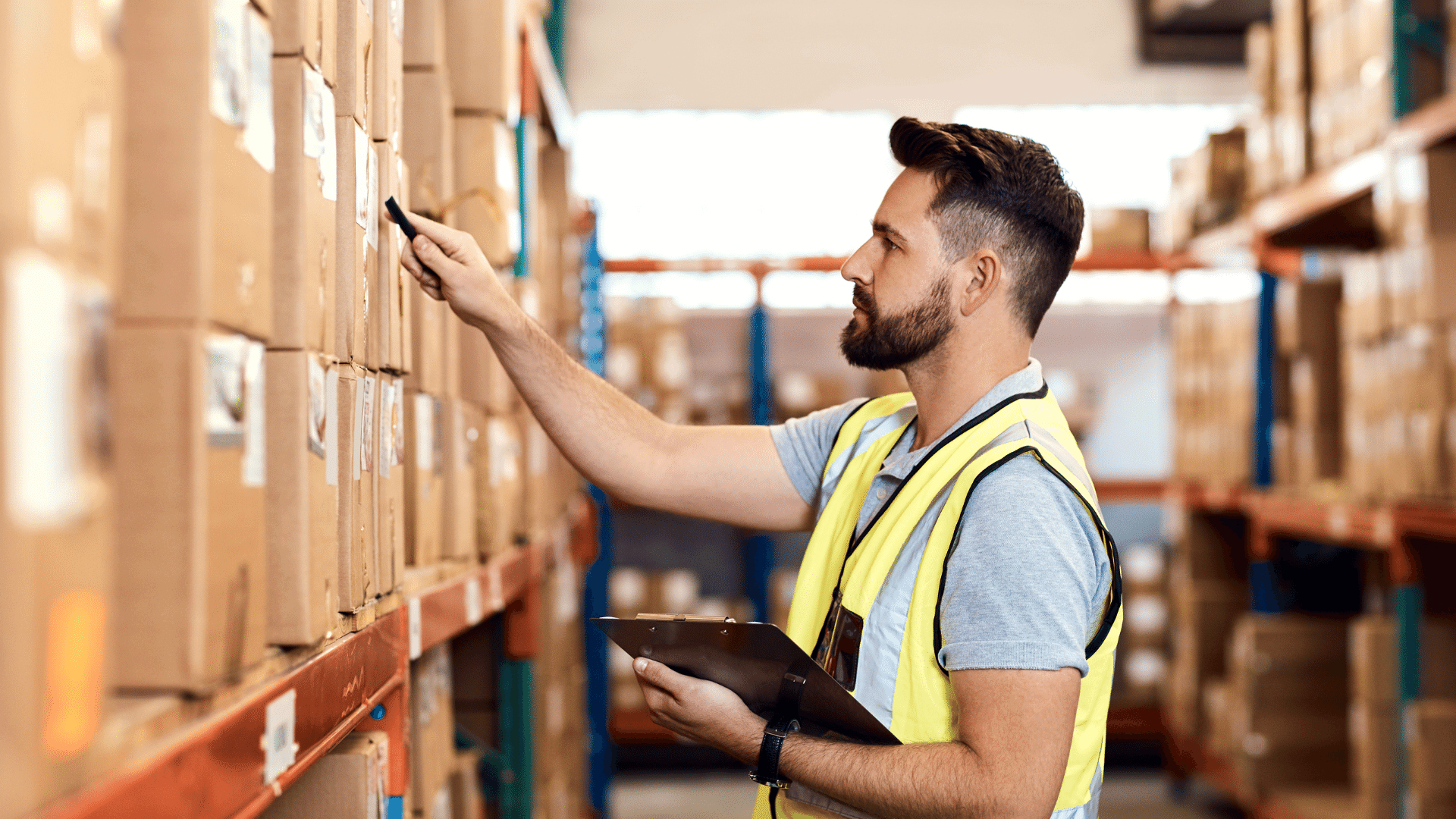 Guy scanning product boxes