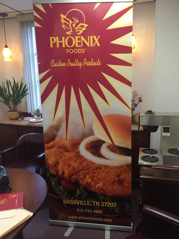Post up banner for a food company at a tradeshow